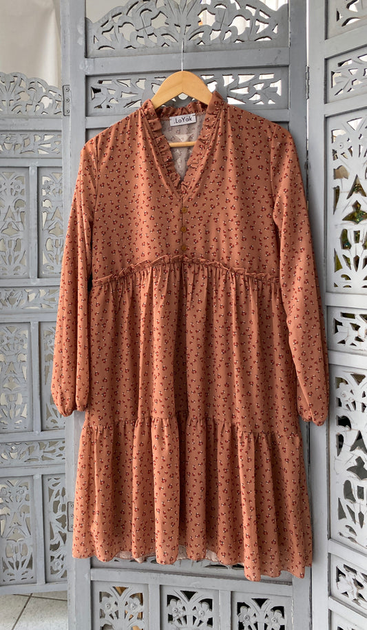 Floral dress with camel ruffles.